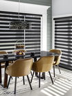 Stores alternés Cascade shades or zebra shades in a dining room, provide versatile light control and a modern, stylish look
