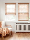 Stores en Bois Laredo 2 wood blinds in a living room.